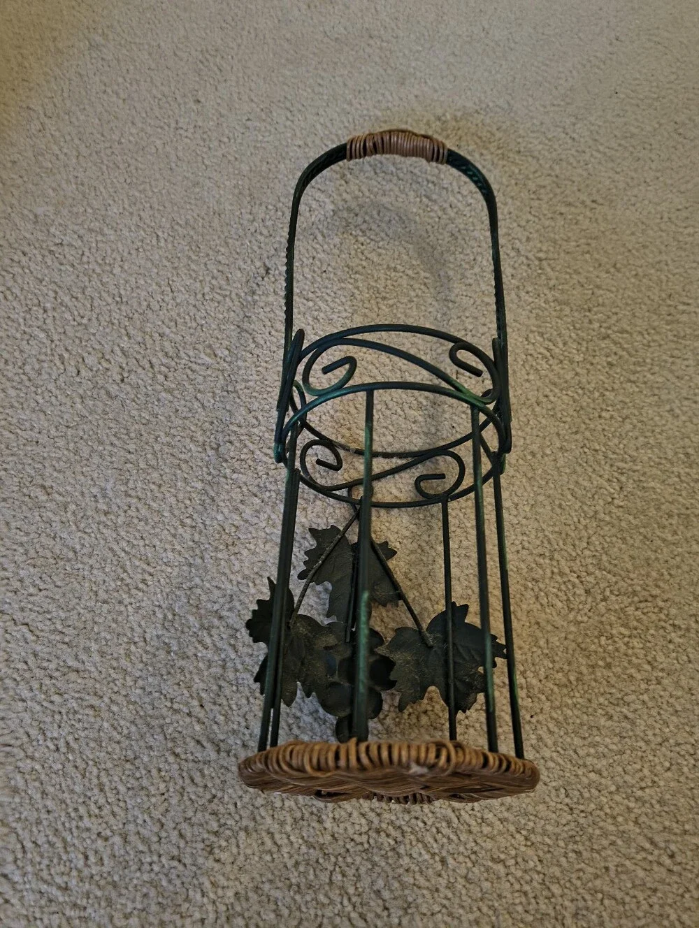 Green Metal Wine bottle Holder with Wicker Base and Leaves.